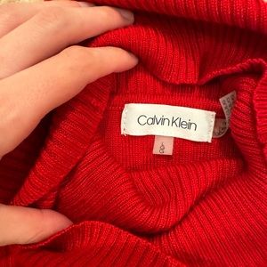 Red Calvin Klein turtleneck sweater